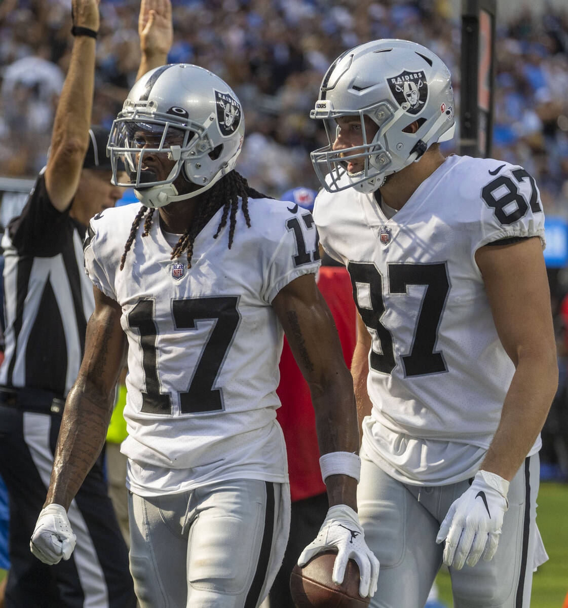 Raiders tight end Foster Moreau (87) celebrates wide receiver Davante Adams (17)’s touch ...