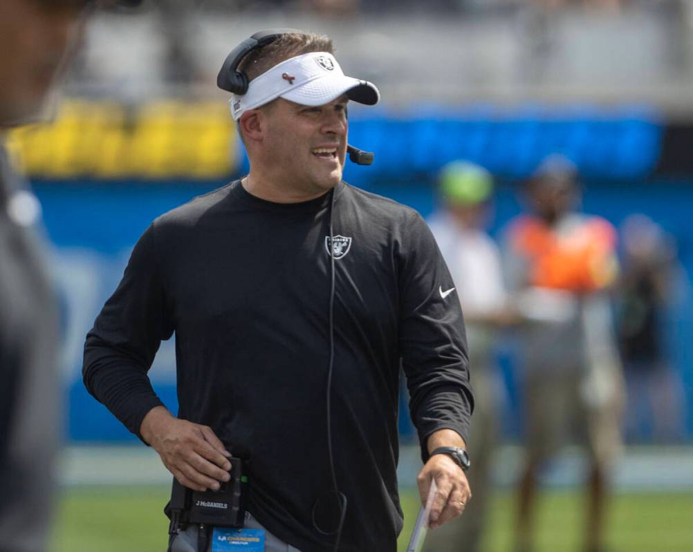 Raiders head coach Josh McDaniels walks the sideline during the first half of an NFL game again ...