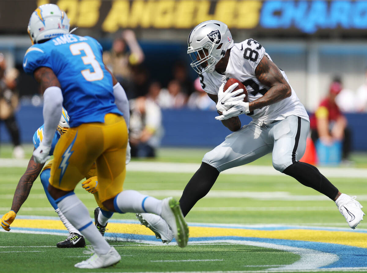 Raiders tight end Darren Waller (83) runs the ball during the first half of a NFL football game ...