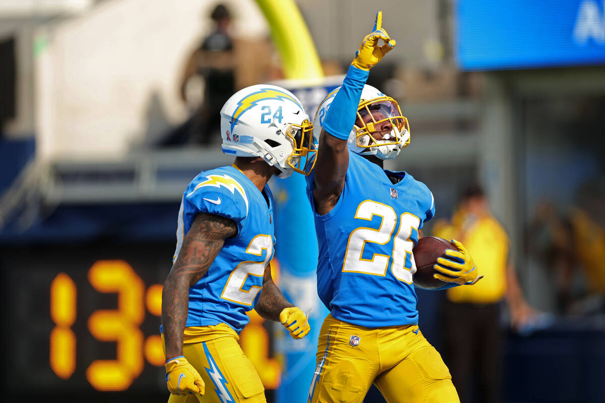 Los Angeles Chargers running back Joshua Kelley (25) reacts after intercepting the the ball aga ...