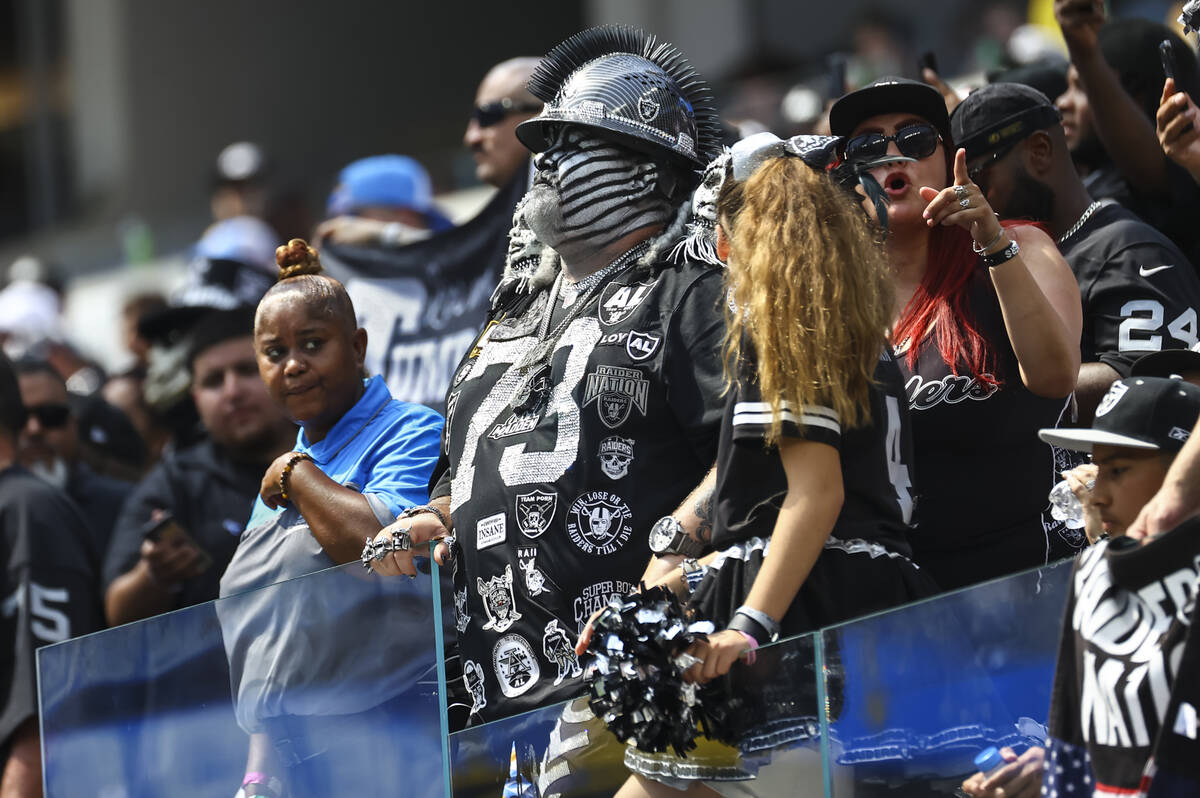Raiders fans look on as they trail the Los Angeles Chargers during the first half of NFL game a ...
