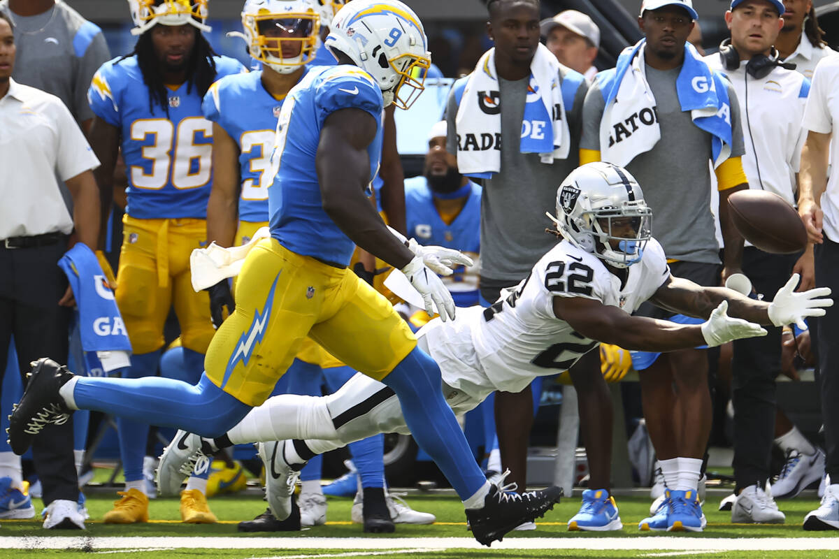 Raiders running back Ameer Abdullah (22) comes up short on a pass in front of Los Angeles Charg ...