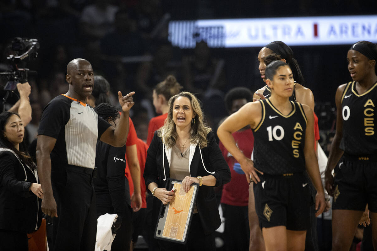 Las Vegas Aces head coach Becky Hammon and her team disperse after a timeout during the first h ...