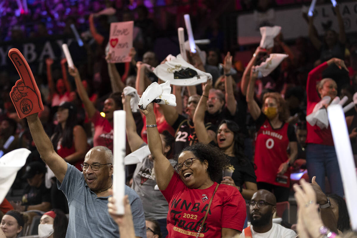 Las Vegas Aces fans cheer for their team during the second half in Game 1 of a WNBA basketball ...
