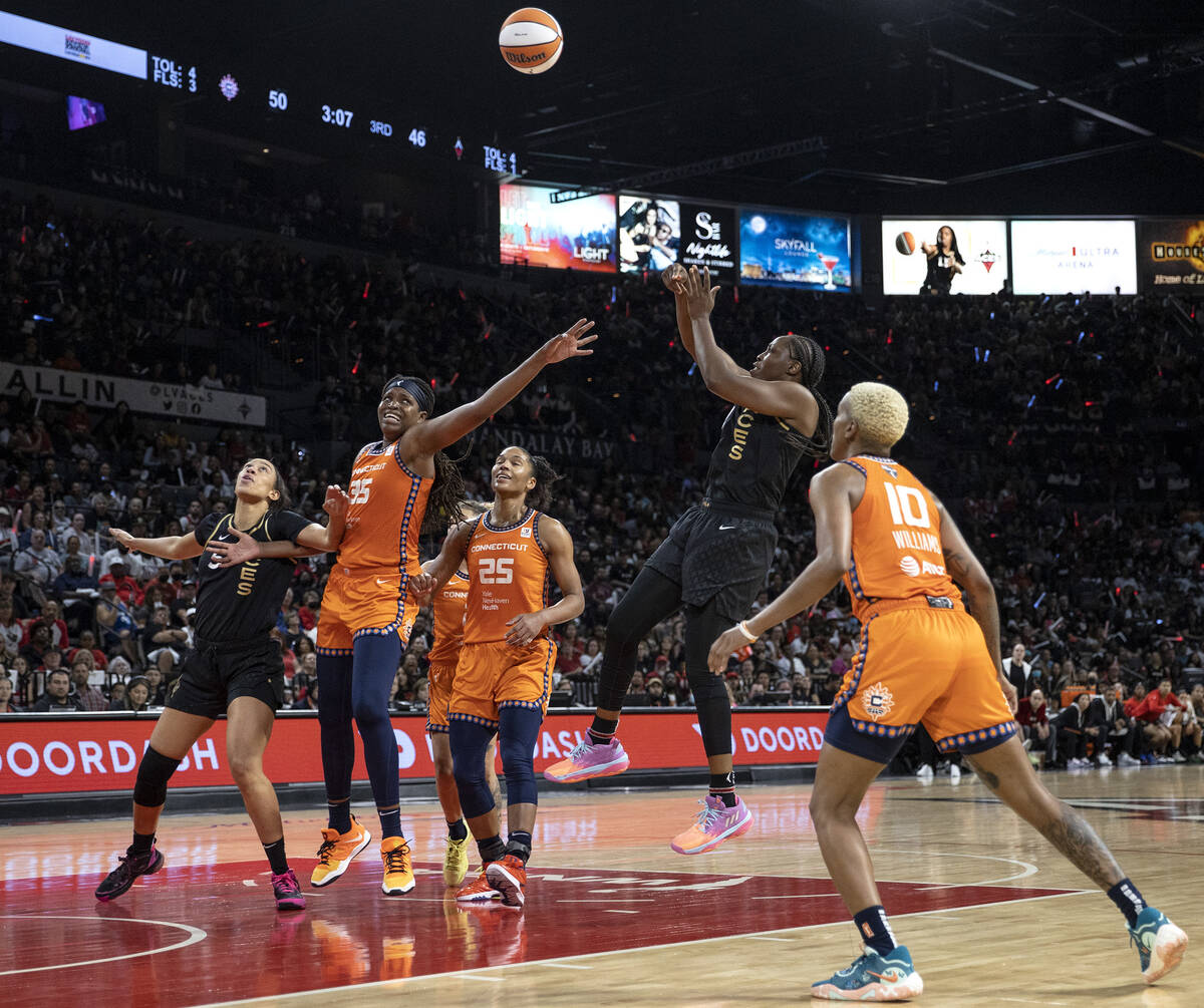 Connecticut Sun forward Jonquel Jones (35), forward Alyssa Thomas (25) and guard Courtney Willi ...