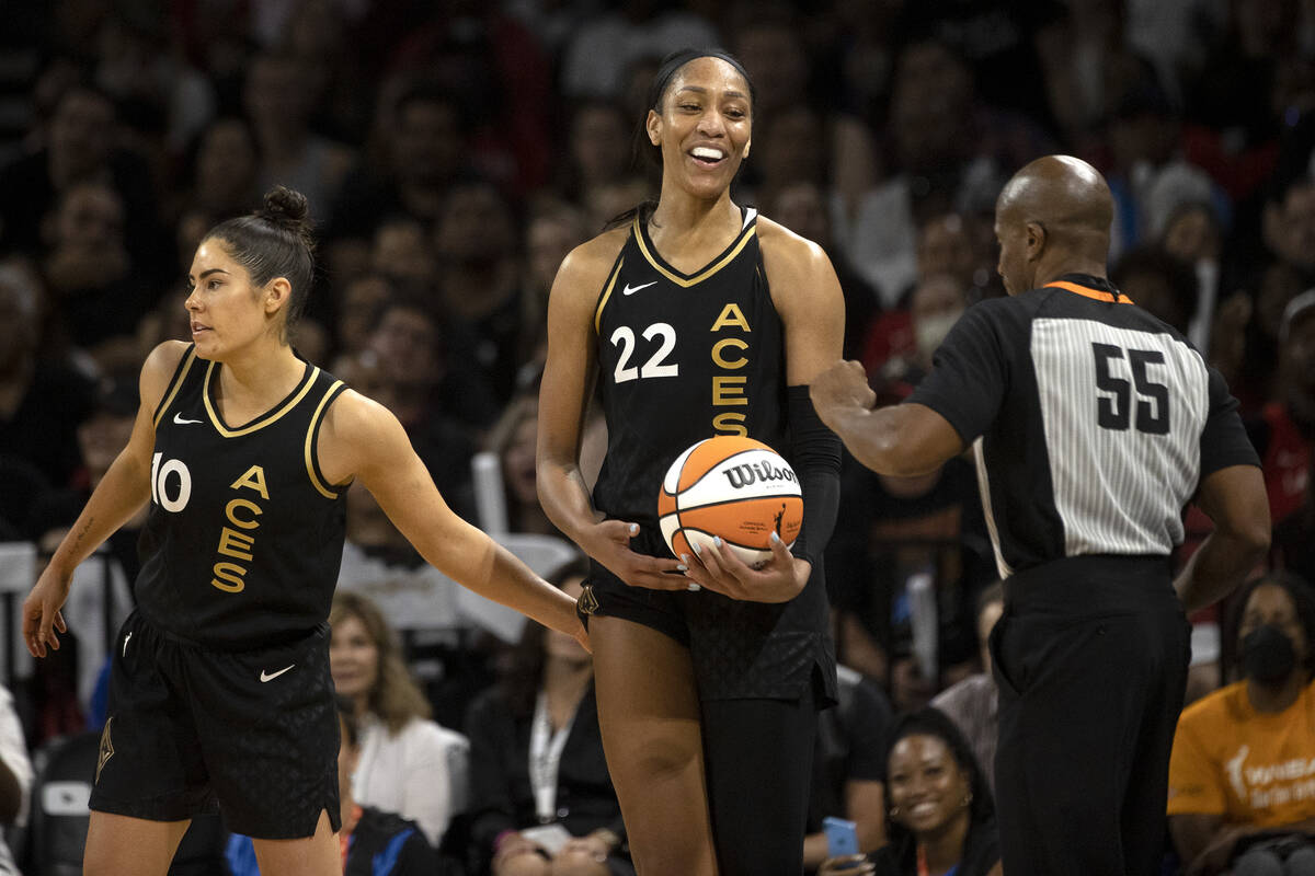 Las Vegas Aces guard Kelsey Plum (10) pats forward A'ja Wilson (22) after she made an offensive ...