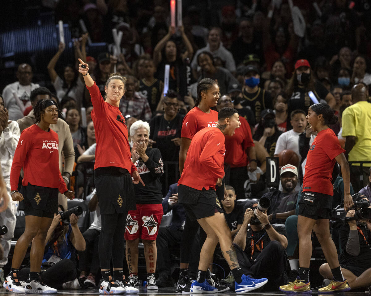 The Las Vegas Aces bench goes wild as their team gains possession of the ball from the Connecti ...