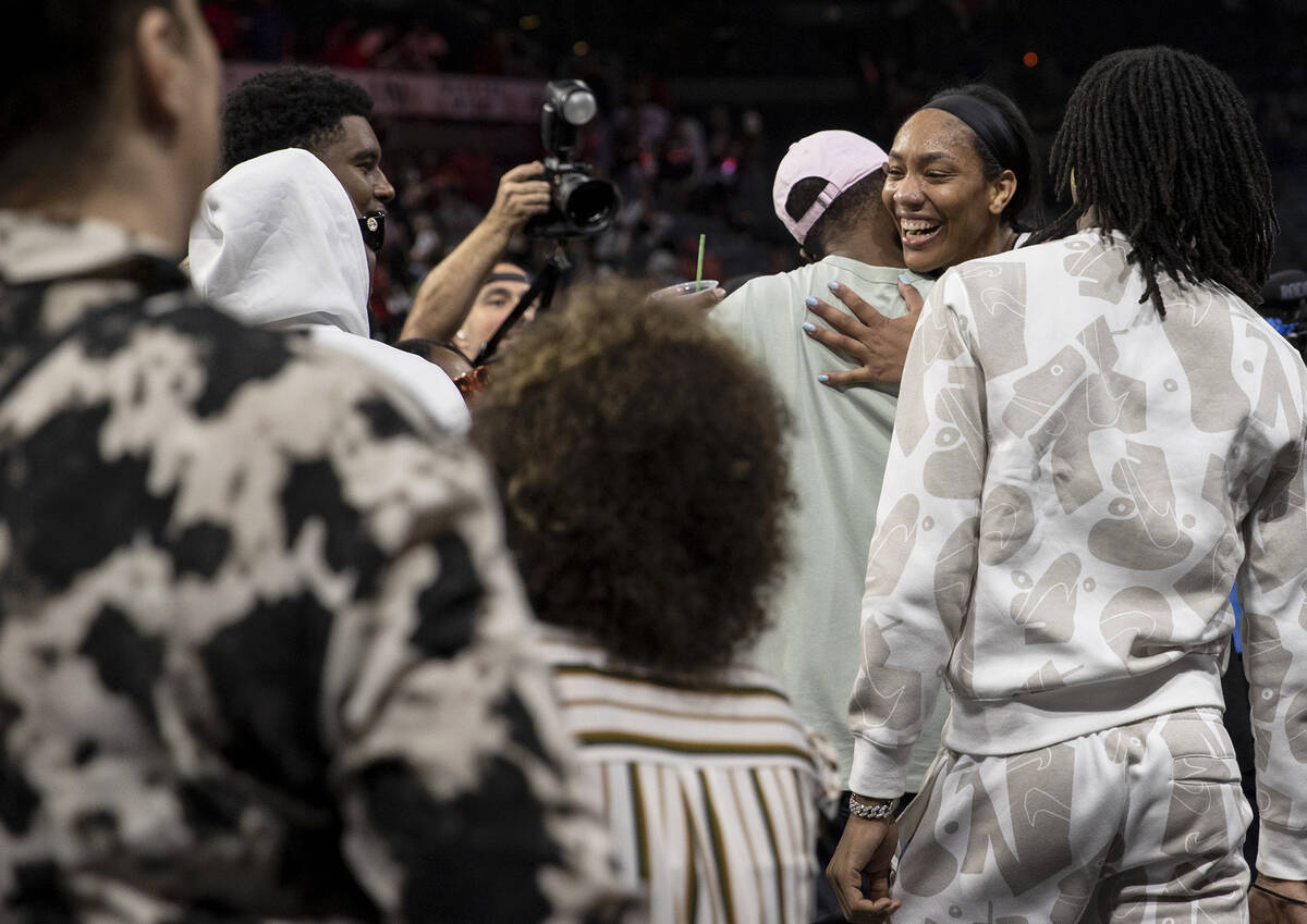 Las Vegas Aces forward A'ja Wilson (22) walks into several hugs as she exits the court after wi ...
