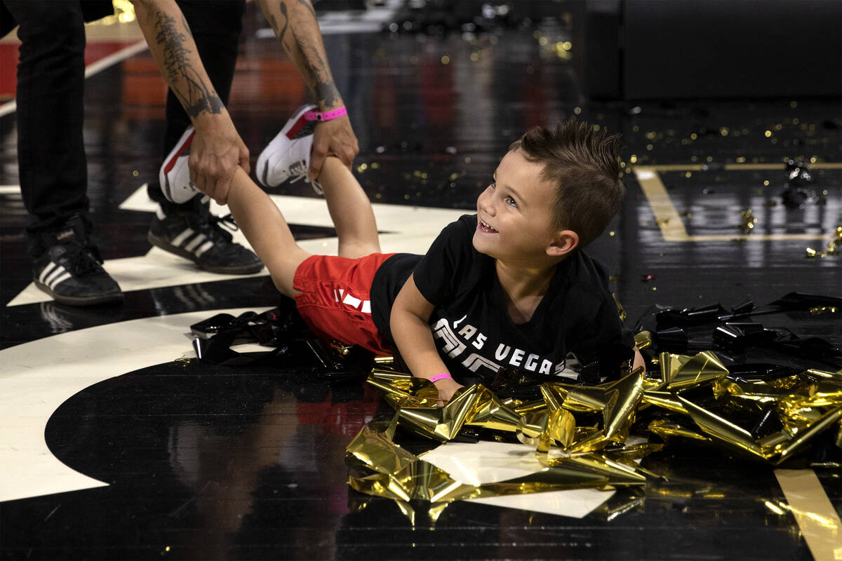 Sam Hammon, 4, Las Vegas Aces head coach Becky Hammon’s son, plays with confetti after t ...