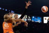 Las Vegas Aces forward A'ja Wilson (22) knocks the ball away from Connecticut Sun guard DiJonai ...