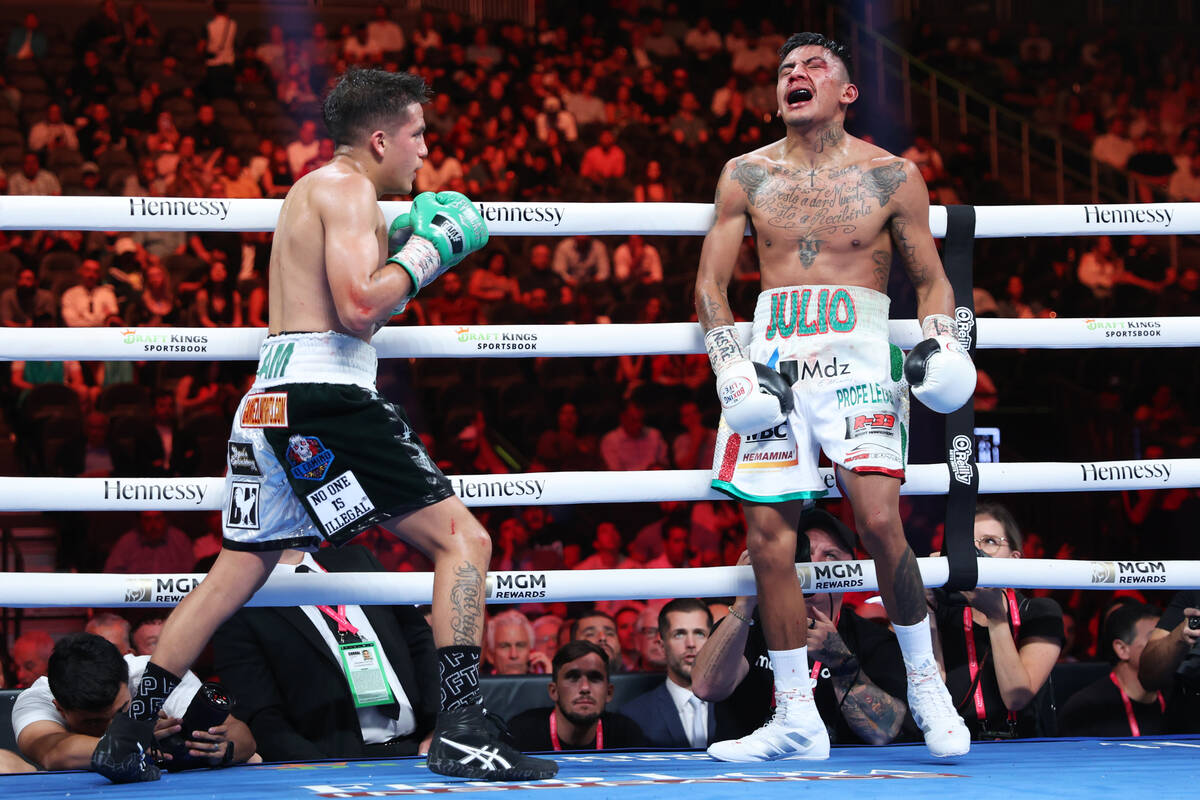 Jesse "Bam" Rodriguez, left, hits Israel Gonzalez with a low blow in the eight round ...