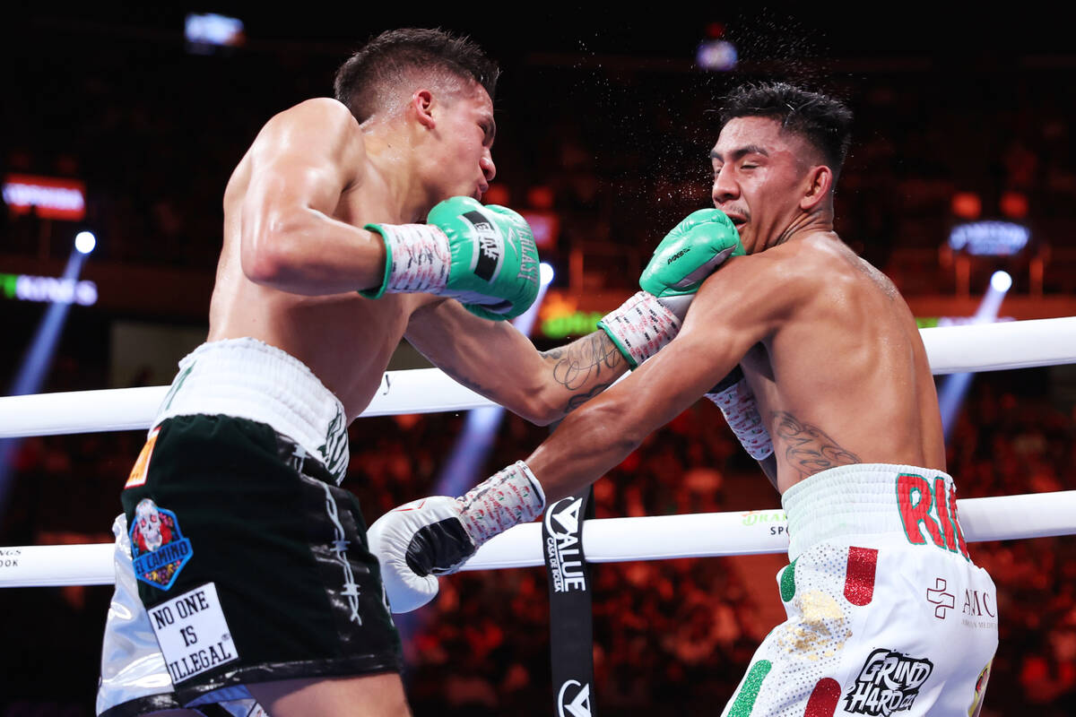 Jesse "Bam" Rodriguez, left, connects a punch against Israel Gonzalez, in the fifth r ...