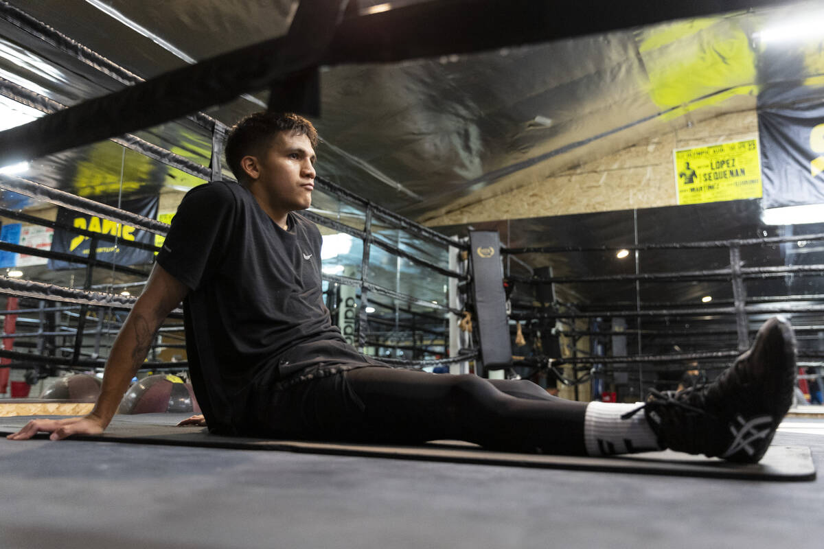 Boxer Jesse "Bam" Rodriguez, left, pauses during a training camp workout at the Rober ...