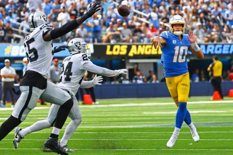 Los Angeles Chargers quarterback Justin Herbert (10) throws a pass against the Raiders during t ...