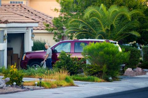 Outgoing Clark County Public Administrator Robert Telles washes his car outside his home on Tue ...