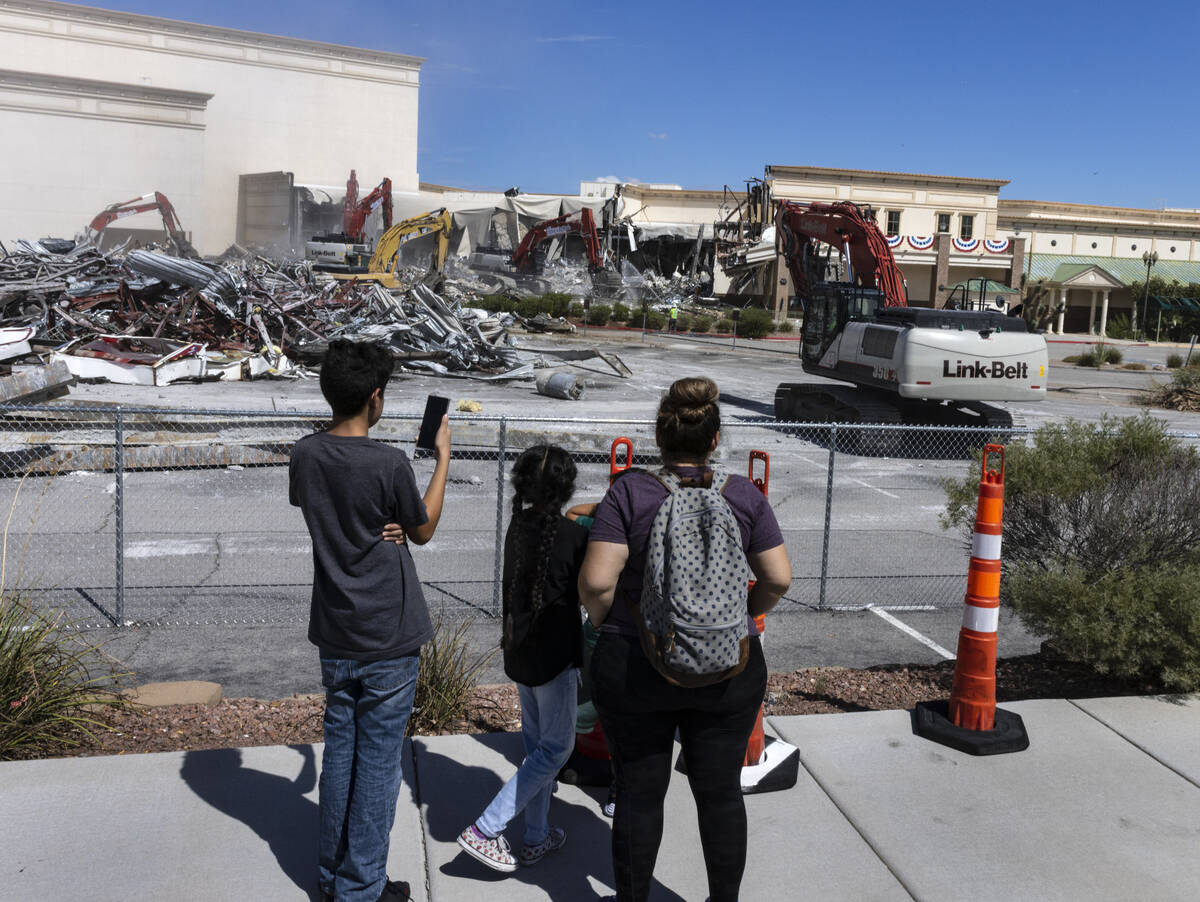 People watch as crews tear down Texas Station, on Monday, Sept. 12, 2022, in North Las Vegas. ( ...