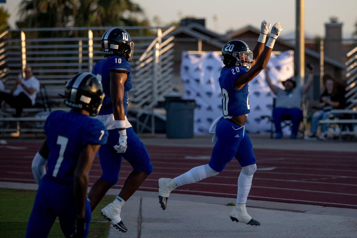 Desert Pines junior Isaiah Rubin (20) celebrates a touchdown during the first half of their gam ...