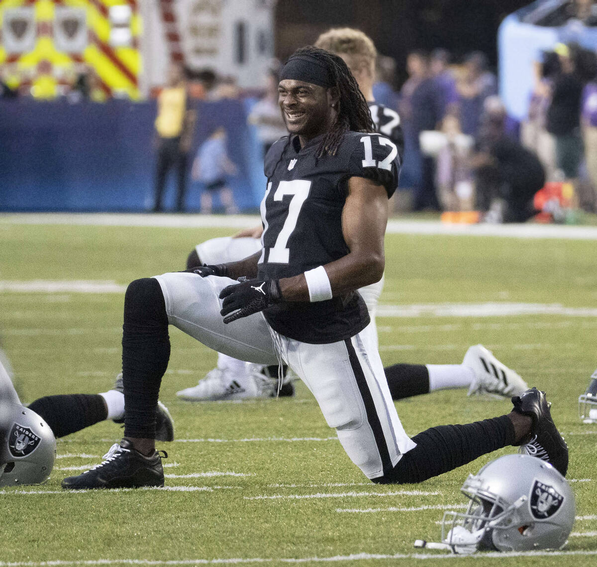 Raiders wide receiver Davante Adams (17) stretches before the NFL Hall of Fame game against the ...