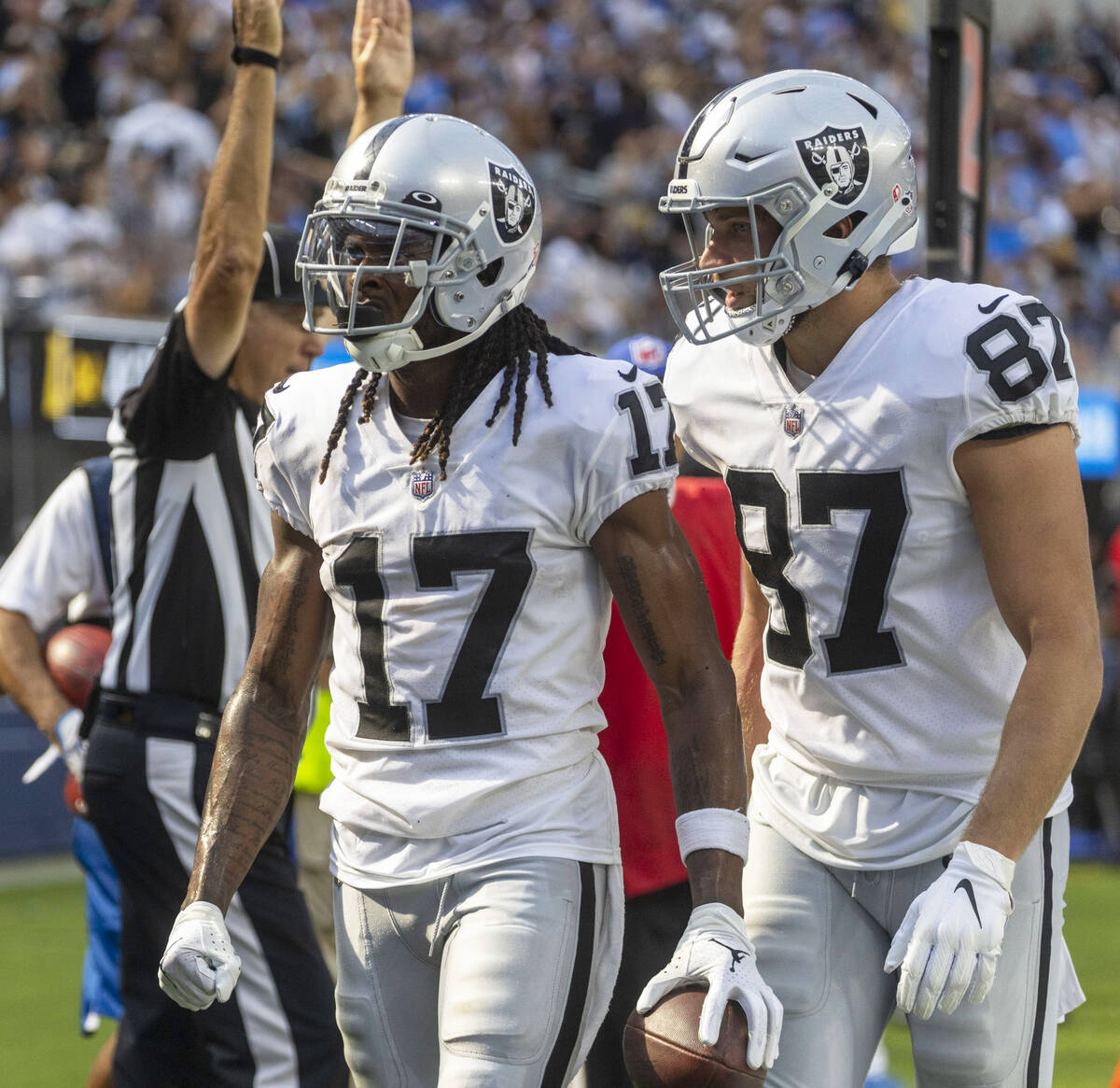 Raiders tight end Foster Moreau (87) celebrates wide receiver Davante Adams (17)’s touch ...