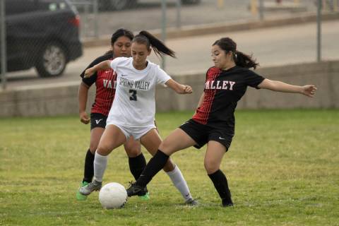Spring Valley High School’s Tyra Nelson (3) tries to break through the Valley High Schoo ...