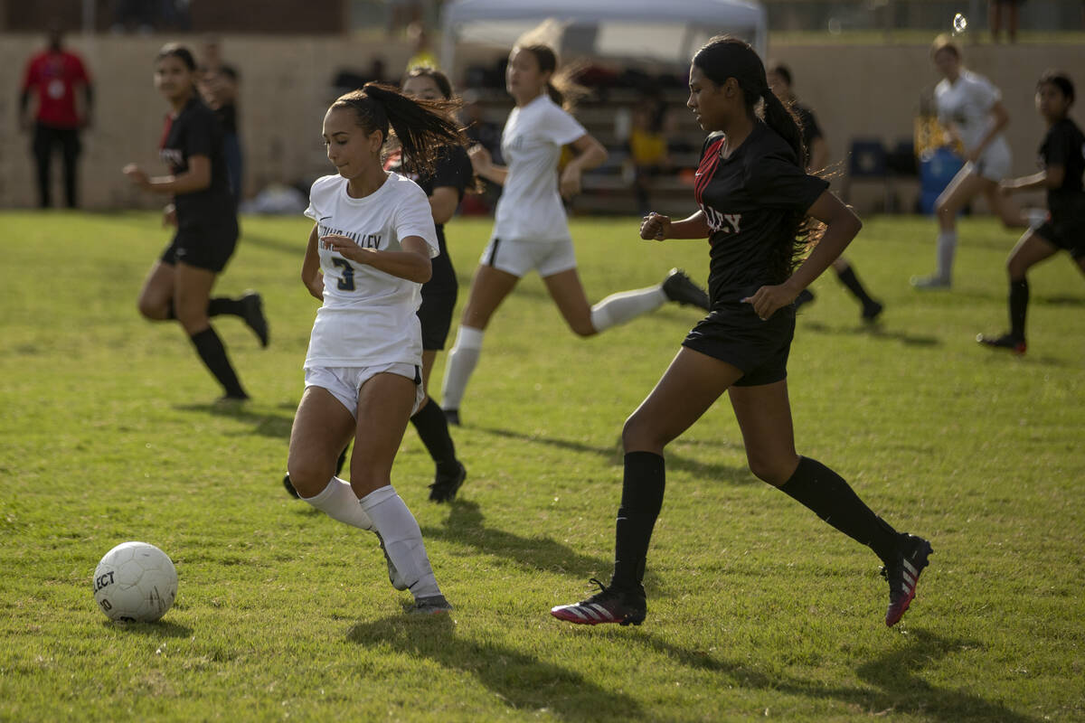 Spring Valley High School’s Tyra Nelson (3) brings the ball up field during their game a ...