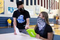 Oracio Garcia, left, a senior at Democracy Prep, helps Zuriah Barlow pre register to vote durin ...