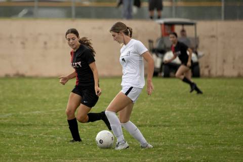 Valley High School’s Quinn Steidler (5) defends Spring Valley High School’s Darya ...