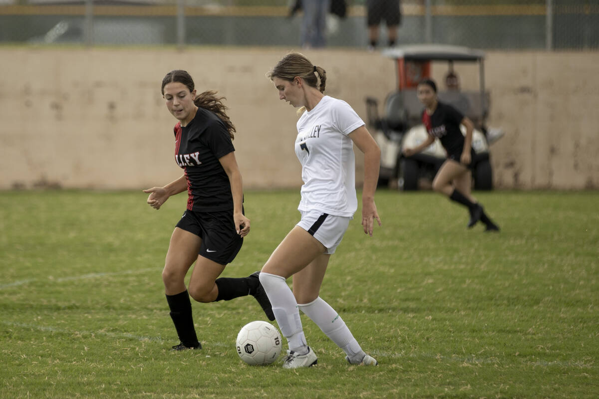 Valley High School’s Quinn Steidler (5) defends Spring Valley High School’s Darya ...