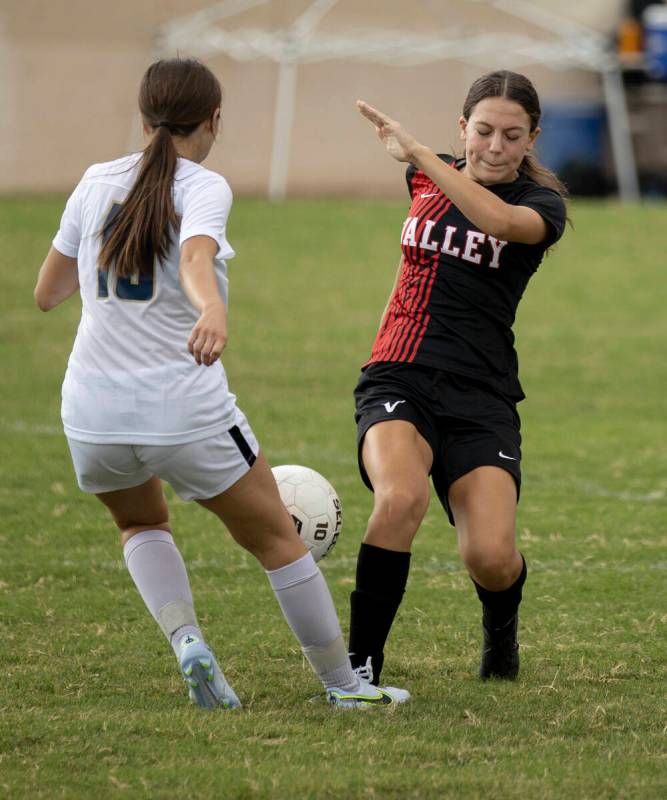 Spring Valley High School’s Lindsey Heinemann (10) defends Valley High School’s Q ...