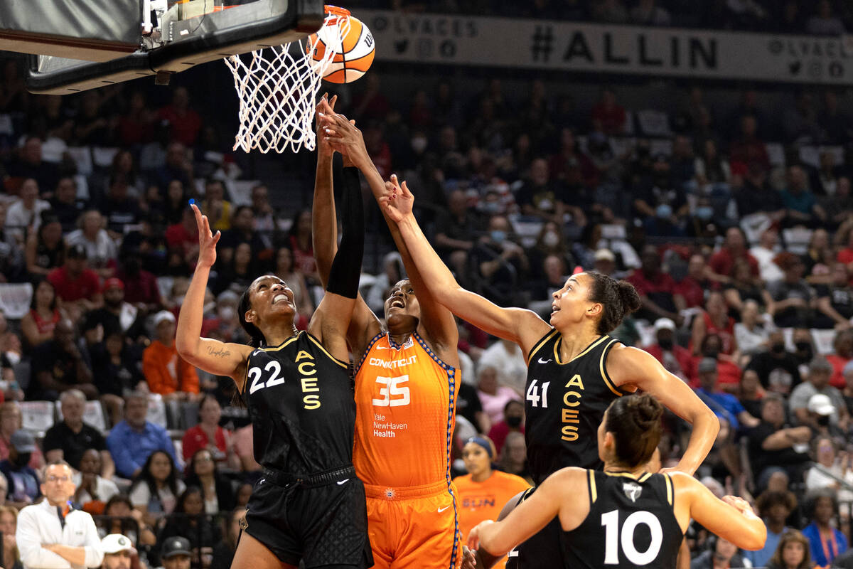 Connecticut Sun forward Jonquel Jones (35) shoots against Las Vegas Aces forward A'ja Wilson (2 ...