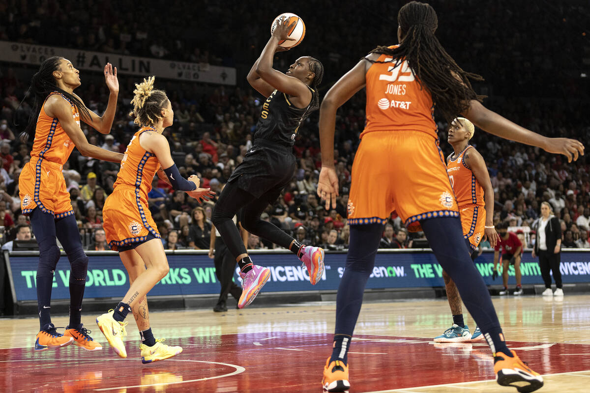 Las Vegas Aces guard Chelsea Gray (12) shoots against the Connecticut Sun during the second hal ...
