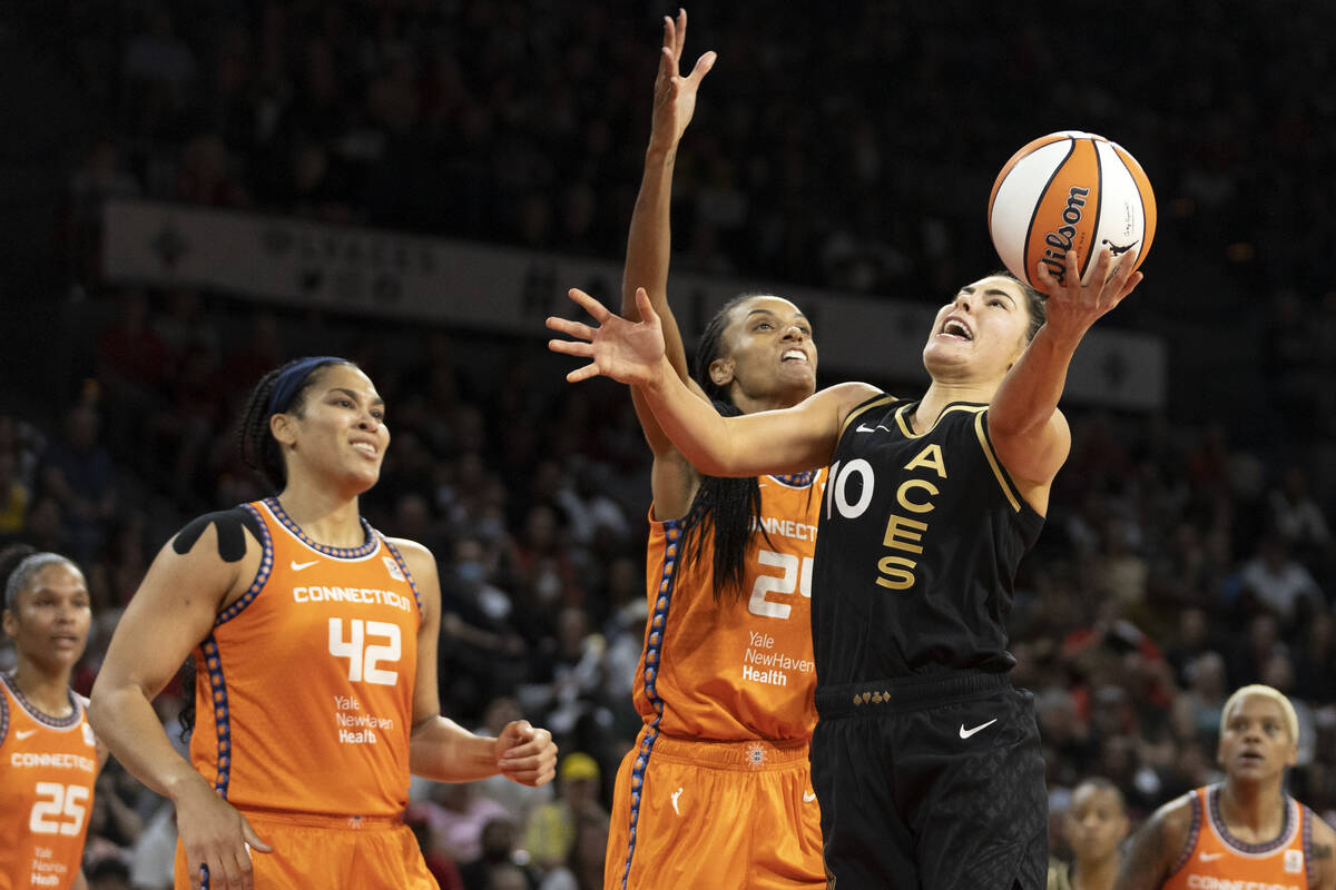 Las Vegas Aces guard Kelsey Plum (10) shoots against Connecticut Sun forward DeWanna Bonner (24 ...