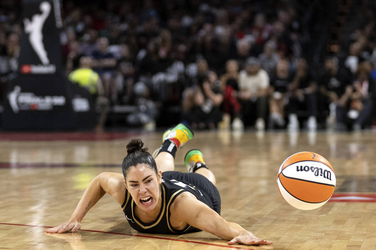 Las Vegas Aces guard Kelsey Plum (10) dives for the ball during the second half in Game 2 of a ...