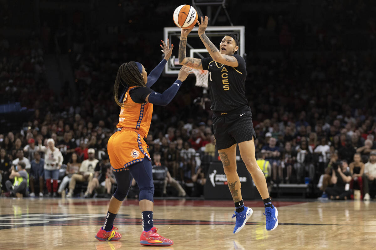 Las Vegas Aces guard Kierstan Bell (1) shoots against Connecticut Sun guard Odyssey Sims (1) du ...