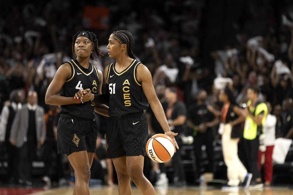 Las Vegas Aces guard Aisha Sheppard (4) and guard Sydney Colson (51) embrace as the final secon ...