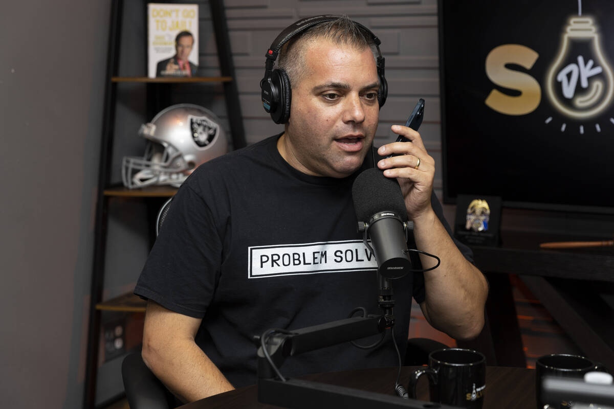 David Kohlmeier, co-host for The Problem Solver podcast, receives a tip over a phone call at th ...