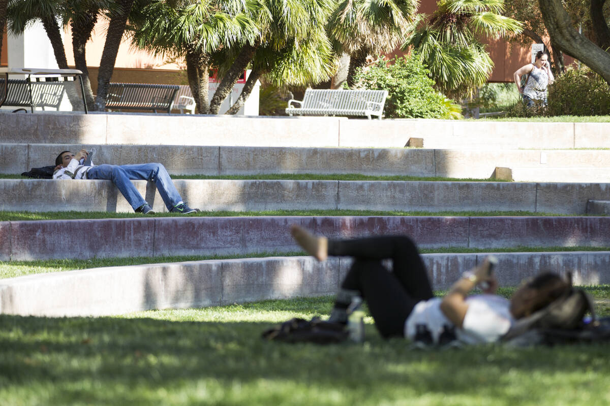 Two people rest on the grass at UNLV on Wednesday, April 20, 2016, in Las Vegas. Erik Verduzco/ ...