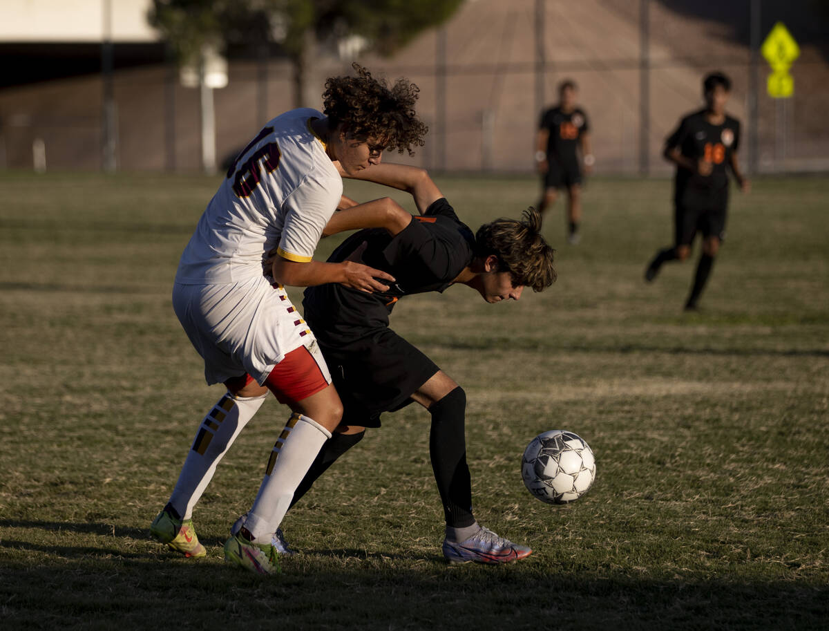 Eldorado's Ivan Martinez (16) and Chaparral's Anthony Zarate (7) fight for the ball during Eldo ...