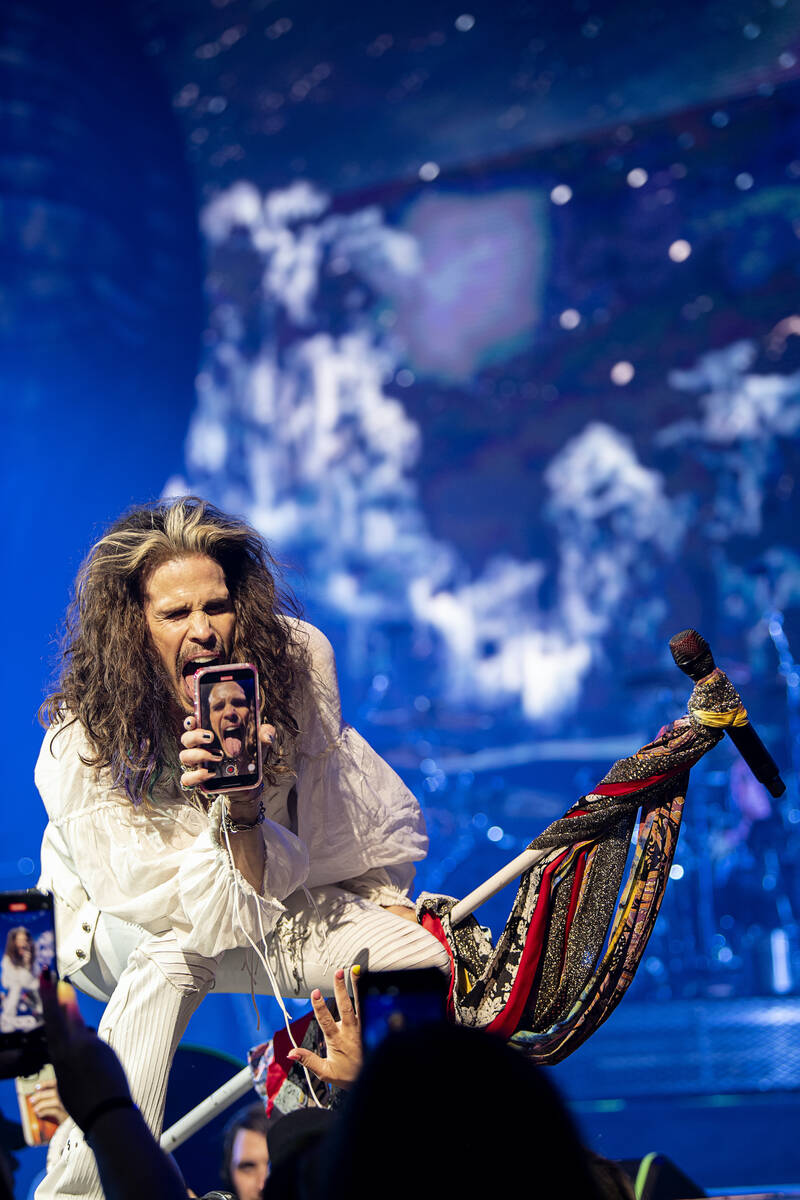 Steven Tyler takes a fan's phone during the return of "Deuces Are Wild" at Dolby Live at Park M ...