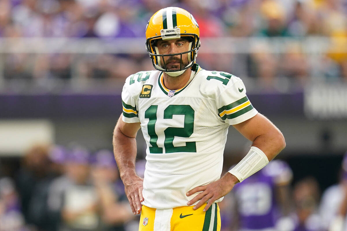 Green Bay Packers quarterback Aaron Rodgers (12) stands on the field during the first half of a ...