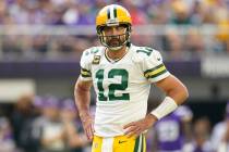 Green Bay Packers quarterback Aaron Rodgers (12) stands on the field during the first half of a ...