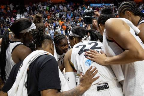 Las Vegas Aces guard Chelsea Gray, center left, speaks to her team after losing Game 3 of a WNB ...
