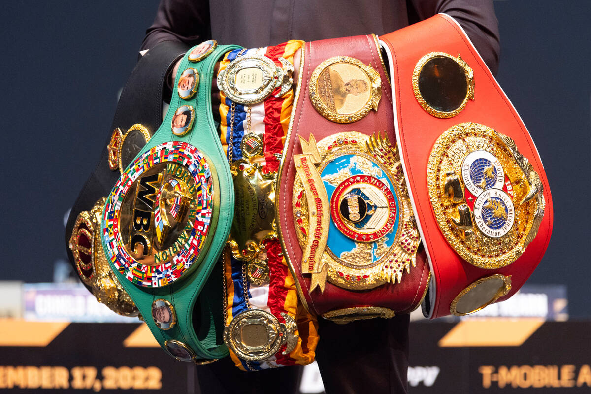 Saul "Canelo" Alvarez poses with his championship belts during a press conference at ...