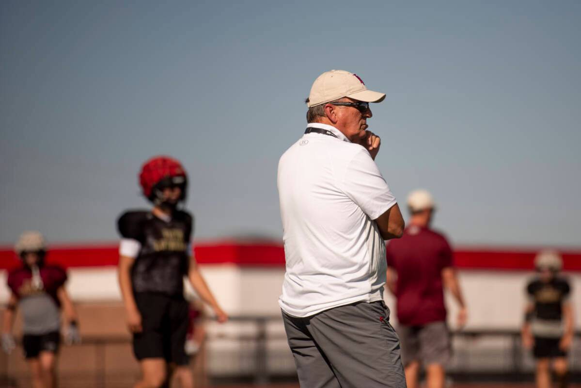 Former UNLV coach, and Faith Lutheran head coach, Mike Sanford leads a drill during practice at ...