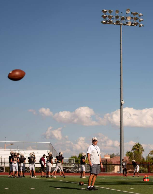 Former UNLV coach, and Faith Lutheran head coach, Mike Sanford leads a drill during practice at ...