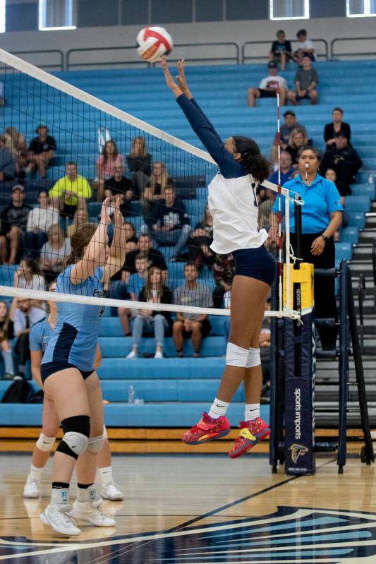 Shadow Ridge's Makaila Brooks (11) makes a hit during their match against Foothill High School ...
