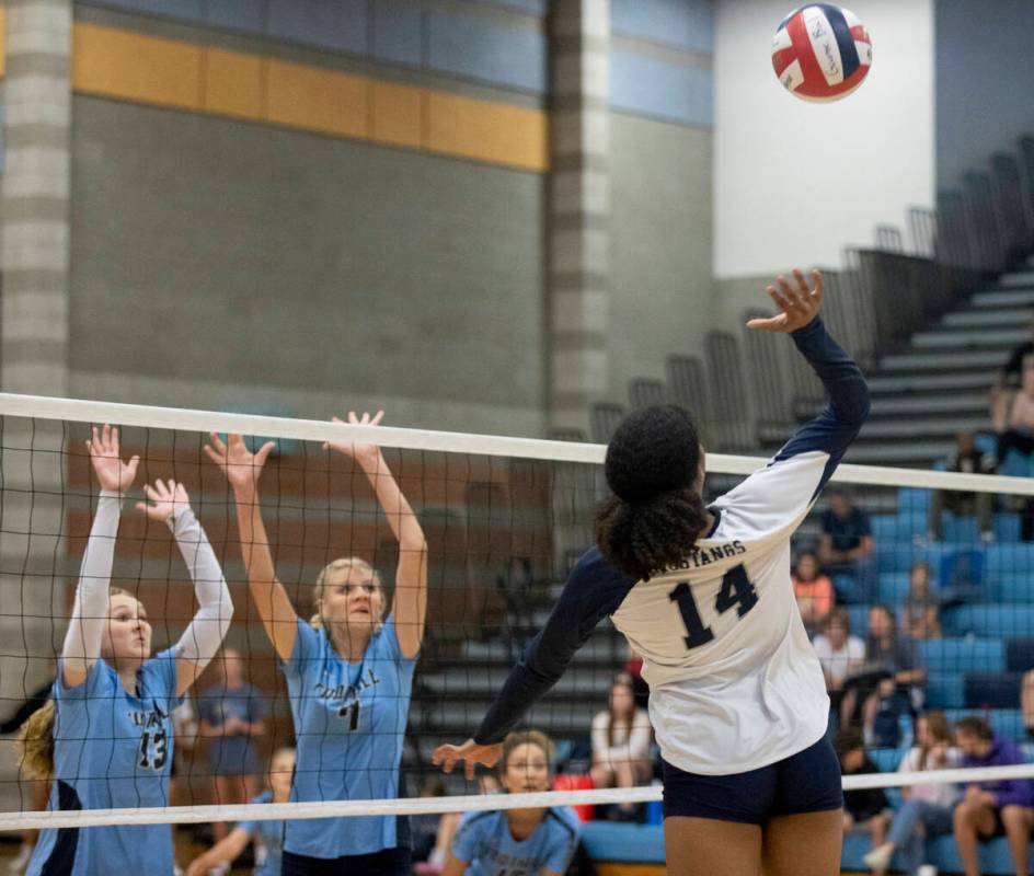 Shadow Ridge's Jyniah Sanders (14) goes up for a hit against Foothill High School on Thursday, ...