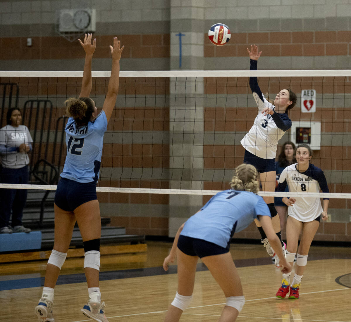 Shadow Ridge's Elaina Smith (3) makes a hit in their game against Foothill High School on Thurs ...