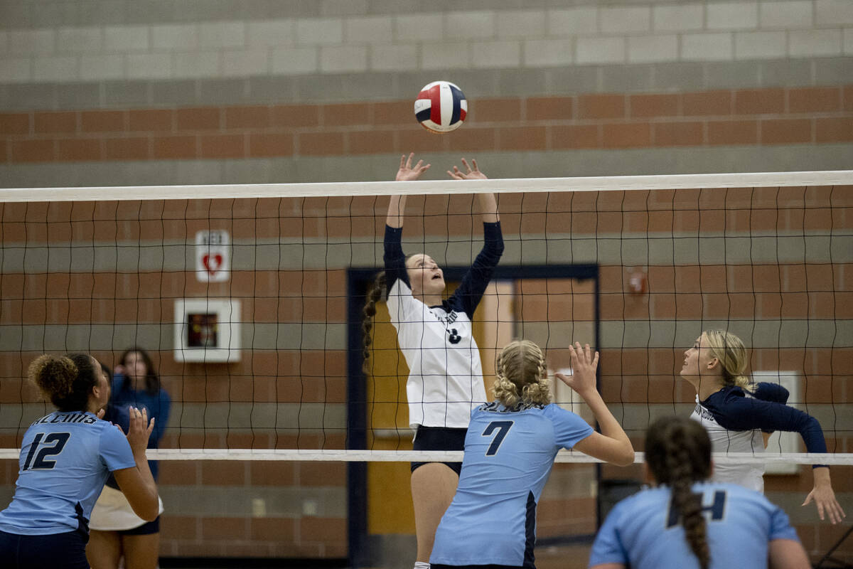 Shadow Ridge's Joli Salazar (8) sets the ball for Lexi Luszeck (9) during their match against F ...