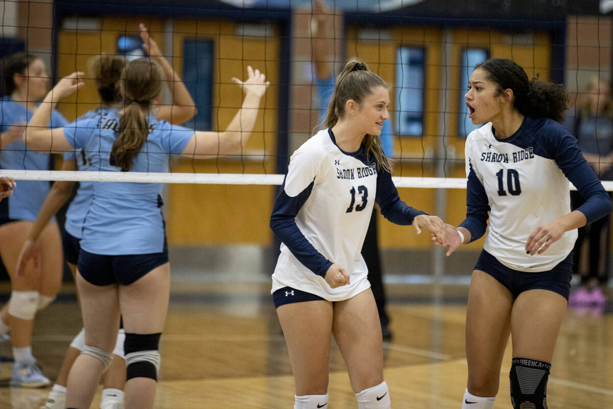 Shadow Ridge's Riah Thurston (13) and Lei Lasike (10) celebrate a point against Foothill High S ...